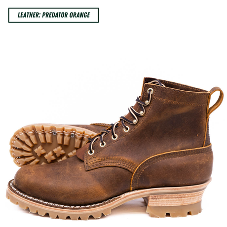 A pair of rugged lace-up ankle boots in distressed brown leather, with one boot showing the side profile and the other showing the treaded outsole. A text label in the top left reads 'LEATHER: PREDATOR ORANGE'.