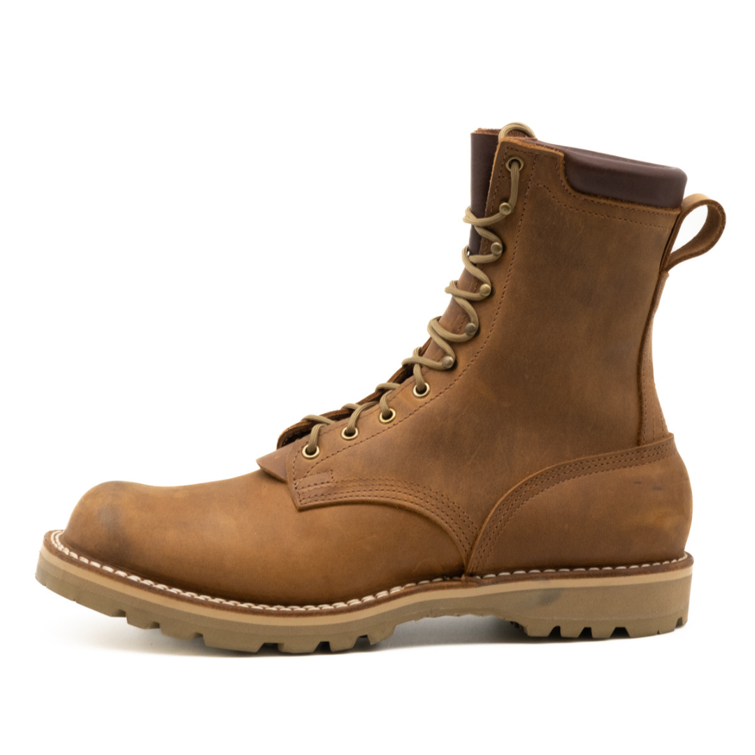 Brown leather boot on a white background