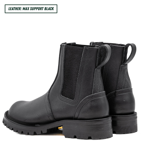 Blackout Chelsea boots showing back profile and heel stack. Top left reads 'LEATHER: MAX SUPPORT BLACK'.