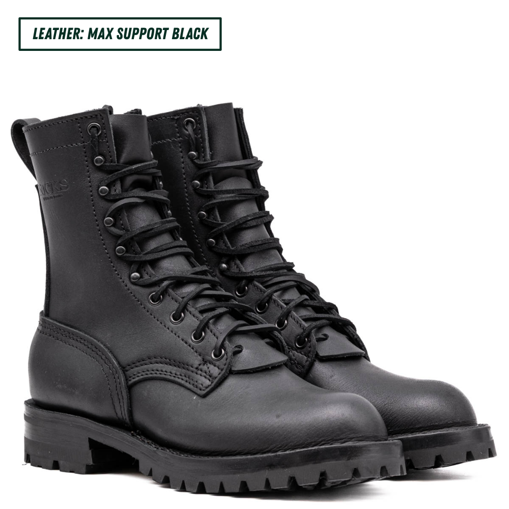 Pair of black leather boots on a white background
