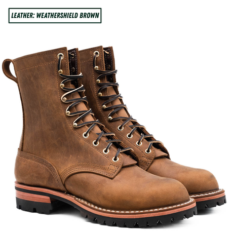 A pair of rugged lace-up work boots in distressed brown leather, shown from a three-quarter angle on a white background with a text label in the top-left corner that reads 'LEATHER: WEATHERSHIELD BROWN'.