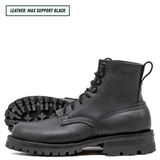 Black leather boots with thick soles on a white background