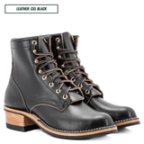 A pair of black leather lace-up ankle boots with brown laces, gold eyelets, and stacked wood-look heels, shown on a white background with a text label reading 'LEATHER: CXL BLACK'.