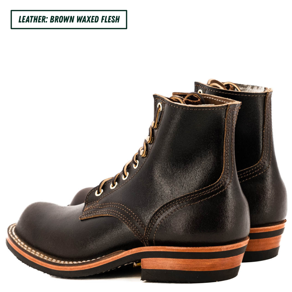 A pair of dark brown waxed leather lace-up ankle boots shown on a white background, with a text label in the top-left corner reading 'LEATHER: BROWN WAXED FLESH'.