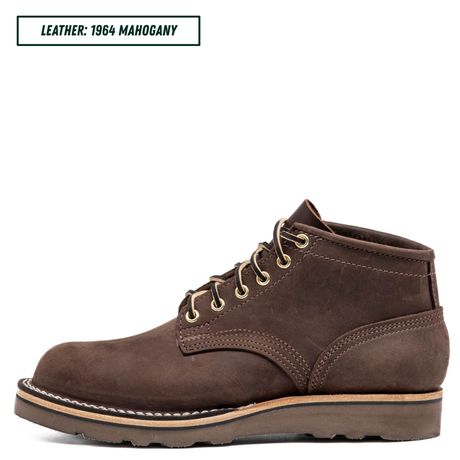 A dark brown suede lace-up ankle boot shown in profile against a white background, with a text label in the top-left corner reading 'LEATHER: 1964 MAHOGANY'.