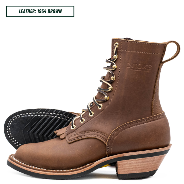A brown leather lace-up boot shown in side profile with a second boot turned to show the black treaded sole. The brand name 'NICKS' is embossed on the side, and a text label in the top left reads 'LEATHER: 1964 BROWN'.