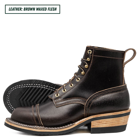 A pair of dark brown waxed leather lace-up boots shown on a white background, with one boot standing upright and the other lying on its side to display the sole. A text label in the top left reads 'LEATHER: BROWN WAXED FLESH'.