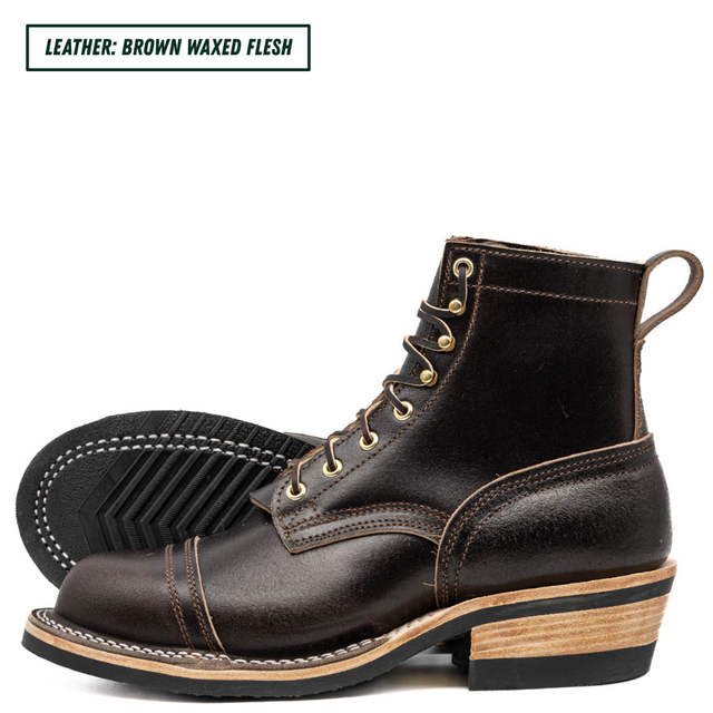 A pair of dark brown waxed leather lace-up boots shown on a white background, with one boot standing upright and the other lying on its side to display the sole. A text label in the top left reads 'LEATHER: BROWN WAXED FLESH'.