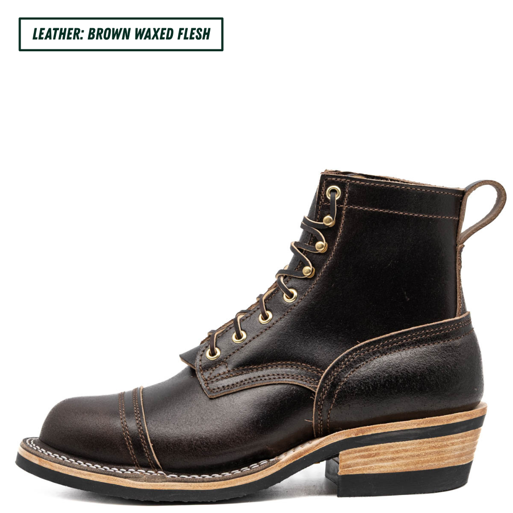 A dark brown waxed leather lace-up ankle boot with gold-tone metal eyelets and a stacked wood-look heel, shown in profile on a white background. A text label in the top-left corner reads 'LEATHER: BROWN WAXED FLESH'.