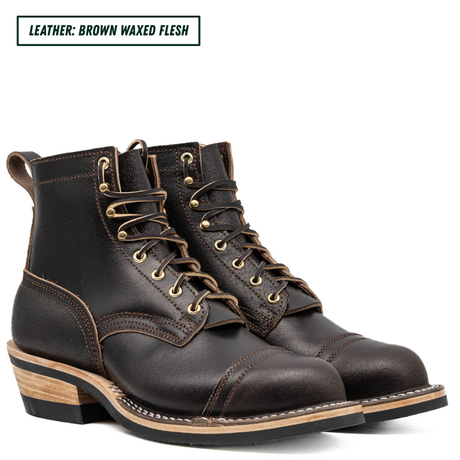 A pair of dark brown leather lace-up boots with a low stacked heel, shown on a white background with a text label in the top left corner.
