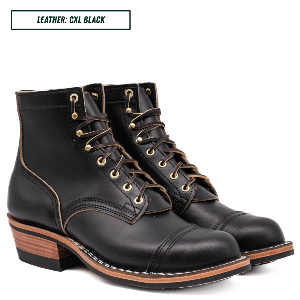 A pair of black leather lace-up ankle boots with gold-toned metal eyelets and laces, shown on a white background with a text label in the top left reading 'LEATHER: CXL BLACK'.