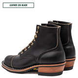 A pair of black leather lace-up ankle boots with gold-tone eyelets and a stacked wood-look heel, shown on a white background with a text label reading 'LEATHER: CXL BLACK'.