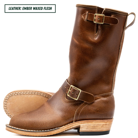 A pair of mid-calf brown leather boots with buckle straps, shown on a white background with a text label in the top left corner reading 'LEATHER: EMBER WAXED FLESH'.