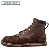 A single dark brown lace-up ankle boot shown in profile on a white background, with a small text label in the top-left corner reading 'LEATHER: 1964 MAHOGANY'. The boot has a suede-like finish, metal eyelets, and a rugged sole.
