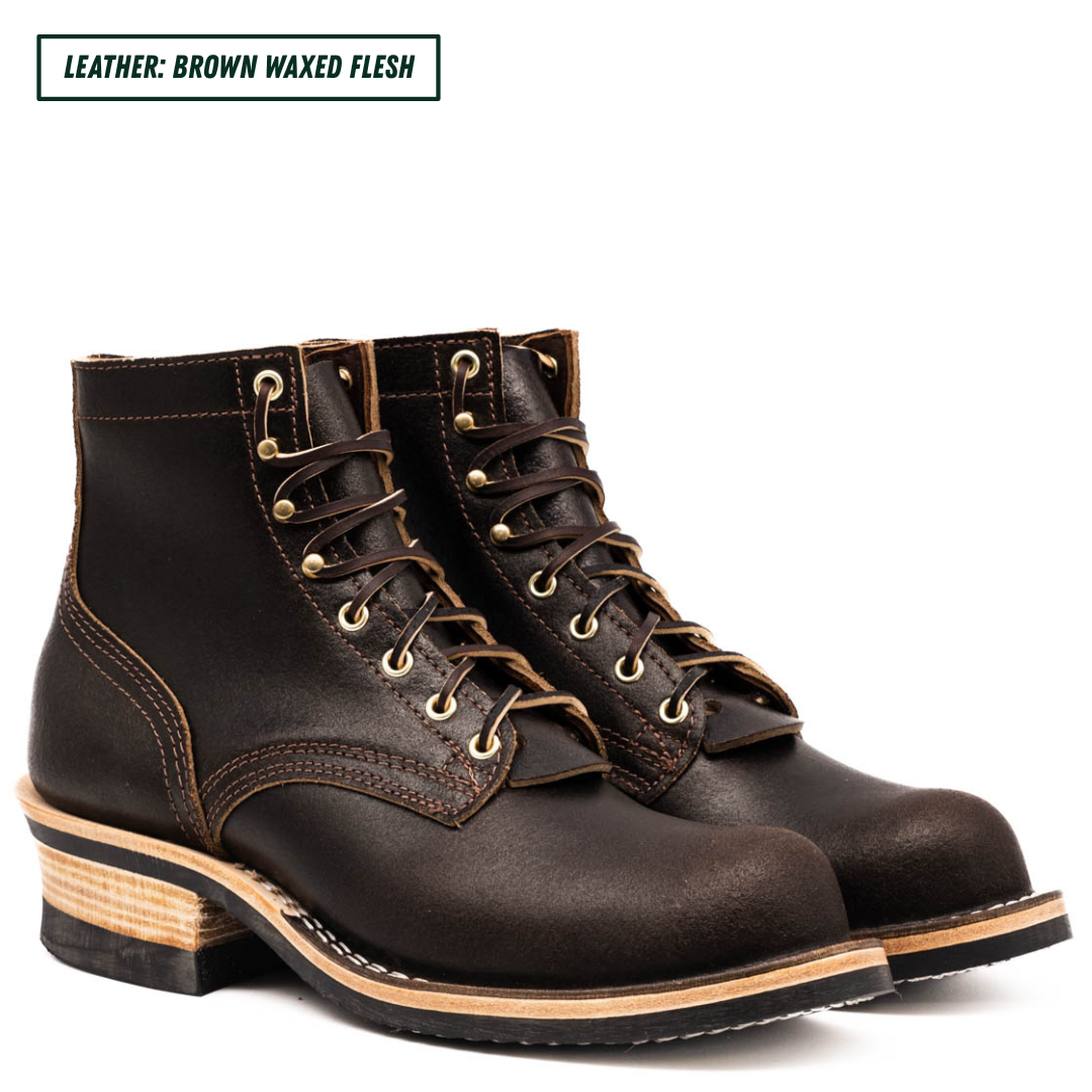 A pair of dark brown waxed leather lace-up boots with gold-toned metal eyelets and stacked wood-look heels, shown on a white background with a text label reading 'LEATHER: BROWN WAXED FLESH'.