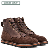 A pair of dark brown suede lace-up boots with gold-tone eyelets and black laces, shown on a white background with a text label reading 'LEATHER: 1964 MAHOGANY' in the top left corner.