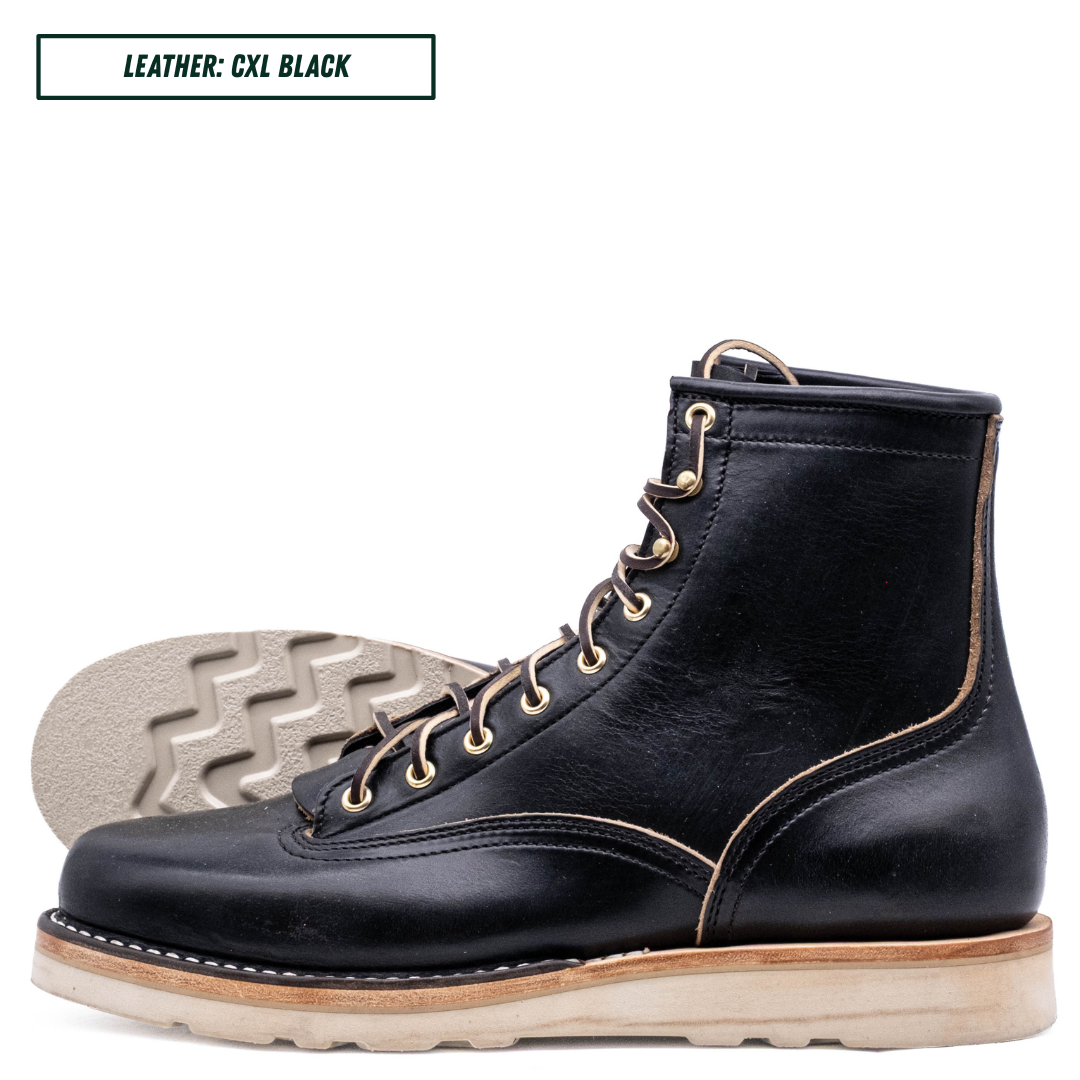 A single black leather lace-up boot shown in side profile on a white background, with a second boot placed behind it to display the sole. A small label at the top reads 'LEATHER: CXL BLACK'.