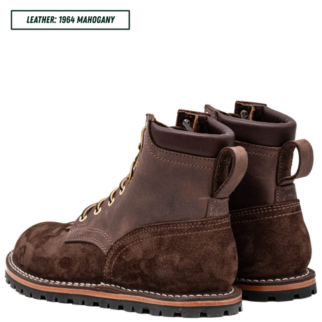 A pair of dark brown leather lace-up boots with a suede-like finish, shown from the side and back on a white background. A text label in the top-left corner reads 'LEATHER: 1964 MAHOGANY'.