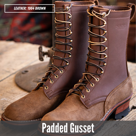 A pair of tall brown leather lace-up boots with a padded gusset, shown on a rustic wooden surface. The image includes text overlays reading 'LEATHER: 1964 BROWN' and 'Padded Gusset'.