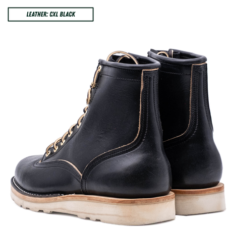 A pair of black leather lace-up ankle boots shown from the side and back on a white background, with a text label in the top left reading 'LEATHER: CXL BLACK'.