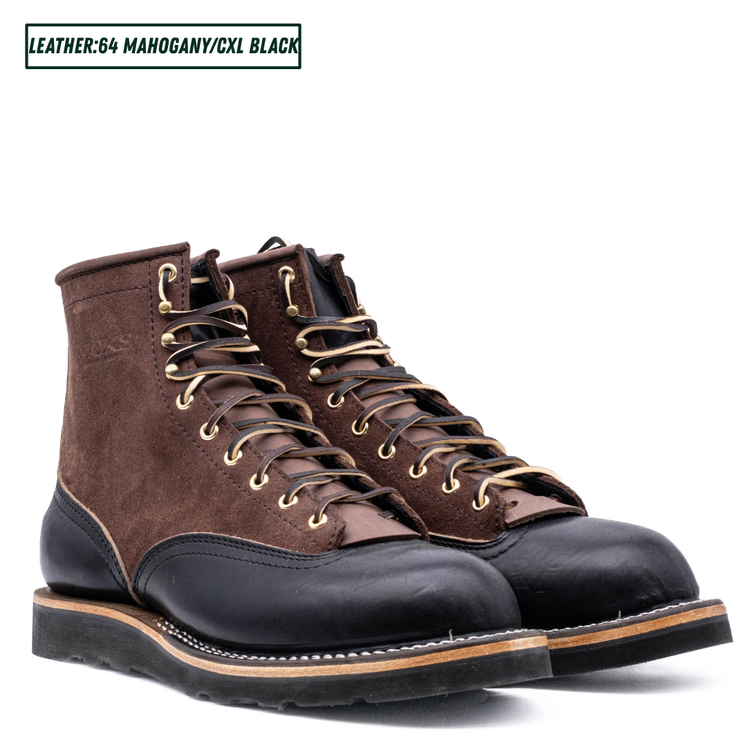 Two tone boots with dark brown roughout uppers and glossy black lowers on a white background. Both boots sitting together. Top left reads 'LEATHER:64 MAHOGANY/CXL BLACK'