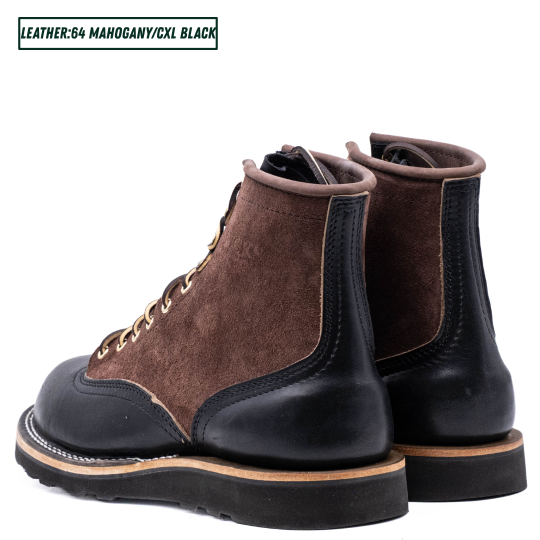 A pair of men's lace-up boots in brown suede and black leather, shown from a three-quarters angle on a white background. A text label in the top-left corner reads 'LEATHER: 64 MAHOGANY/CXL BLACK'.