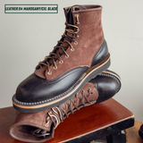 Two tone boots with dark brown roughout uppers and glossy black lowers on a wooden stool. One boot sitting upright on the other laying on its side. Top left reads 'LEATHER:64 MAHOGANY/CXL BLACK'