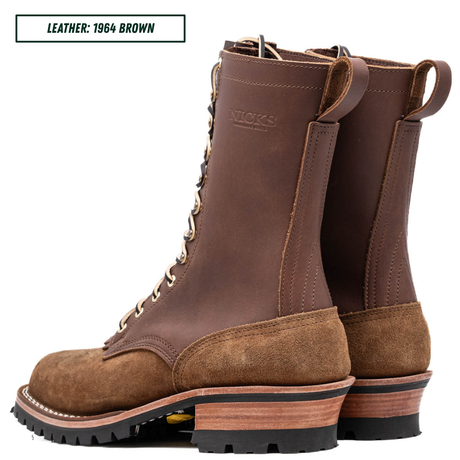 A pair of brown leather lace-up boots shown on a white background, with a text label in the top-left corner reading 'LEATHER: 1964 BROWN'. The boots feature a dark brown leather shaft, a lighter brown suede toe and heel, and a stacked wood-look midsole with a black outsole.