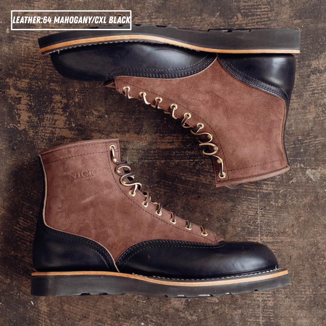 Two tone boots with dark brown roughout uppers and glossy black lowers laying on textured concrete. Top left reads 'LEATHER:64 MAHOGANY/CXL BLACK'
