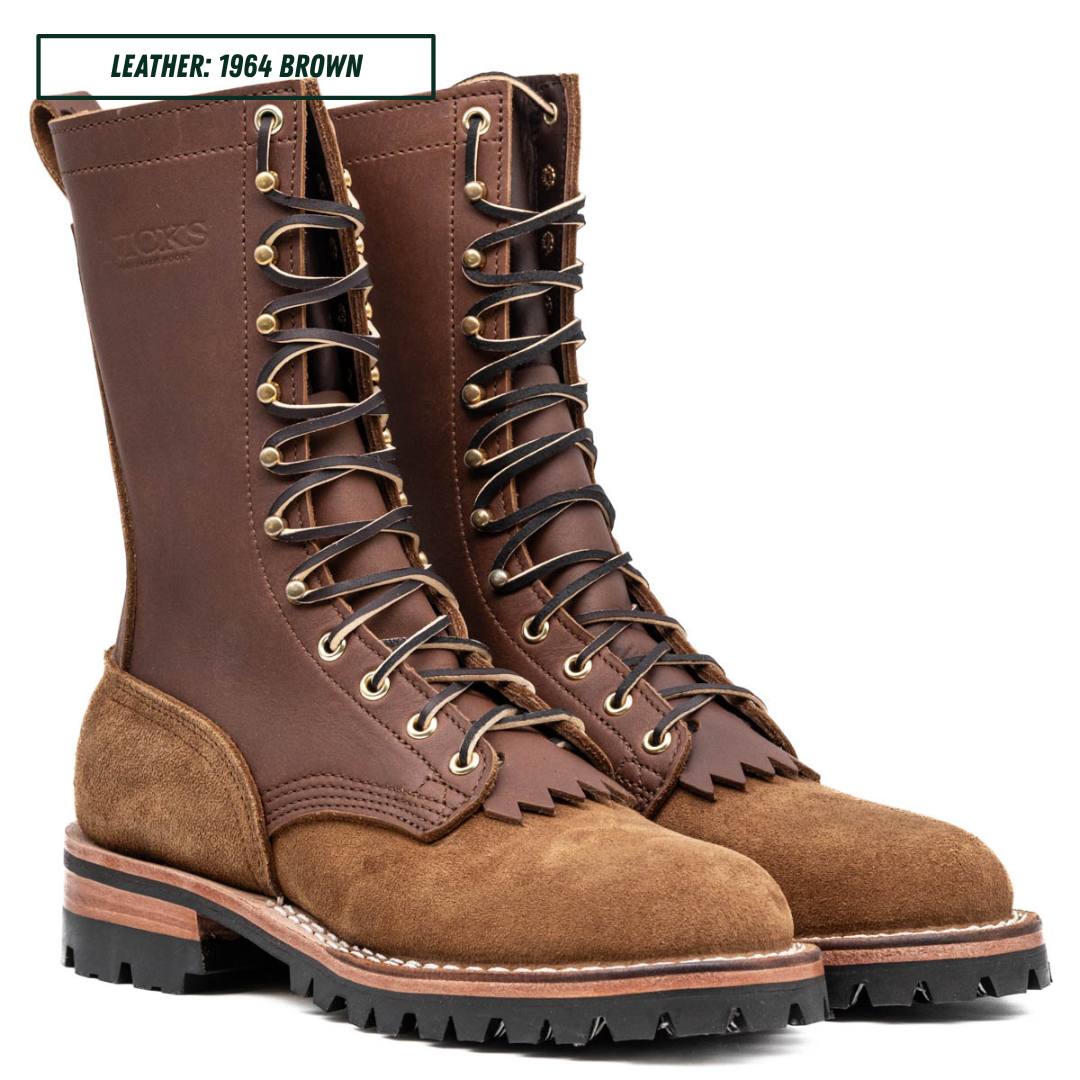 A pair of high-top lace-up boots in brown leather and suede, shown on a white background with a text label in the top-left corner that reads 'LEATHER: 1964 BROWN'.