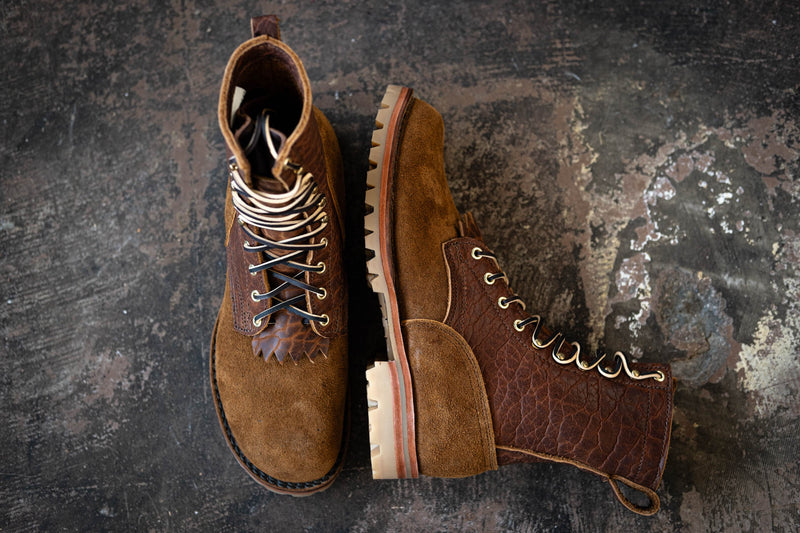 Brown suede and textured leather lace-up work boots with lug soles shown from top and side views