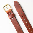 Brown leather heavy duty work belt with a brass buckle and embossed Nicks logo