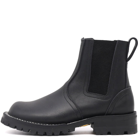 Black Chelsea boot on a white background