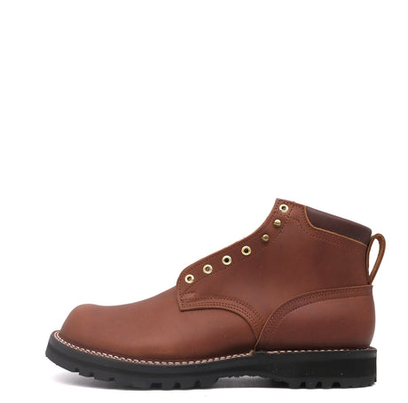 Brown leather boot with brass hardware and a brown padded collar on a white background