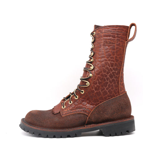 Brown leather boot with brass hardware on a white background. 10" Height with a lug sole 