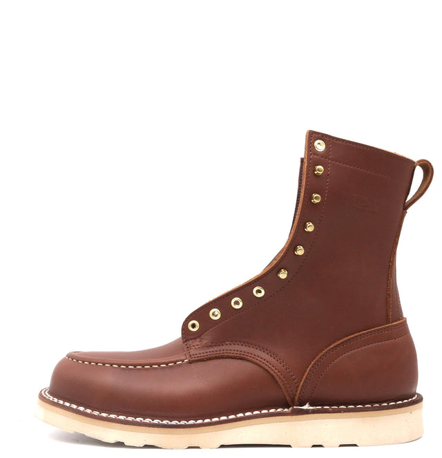 Brown leather boot with brass hardware, moc toe stitching, white wedge sole on a white background