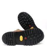 Close-up of black boot soles with brand logo on a white background