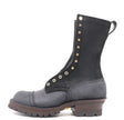 Black boot with gusset on a white background. Brass hardware, 4 row toe cap, brown edge color, lug sole 
