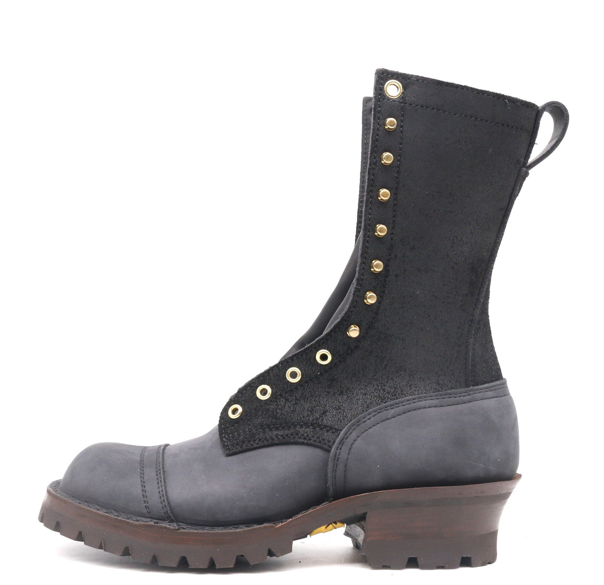 Black boot with gusset on a white background. Brass hardware, 4 row toe cap, brown edge color, lug sole 