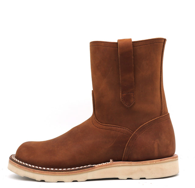 Brown leather pull-on boot in front of a white background