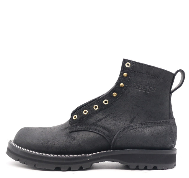 Nicks black roughout leather work boot with brass eyelets pull tab and black lugged sole shown unlaced