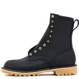 Black boot with gold buttons on a white background