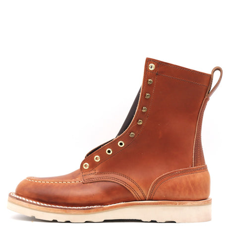 A single brown leather lace-up ankle boot with brass eyelets, a pull tab, and a thick off-white sole, shown from a side profile on a white background.