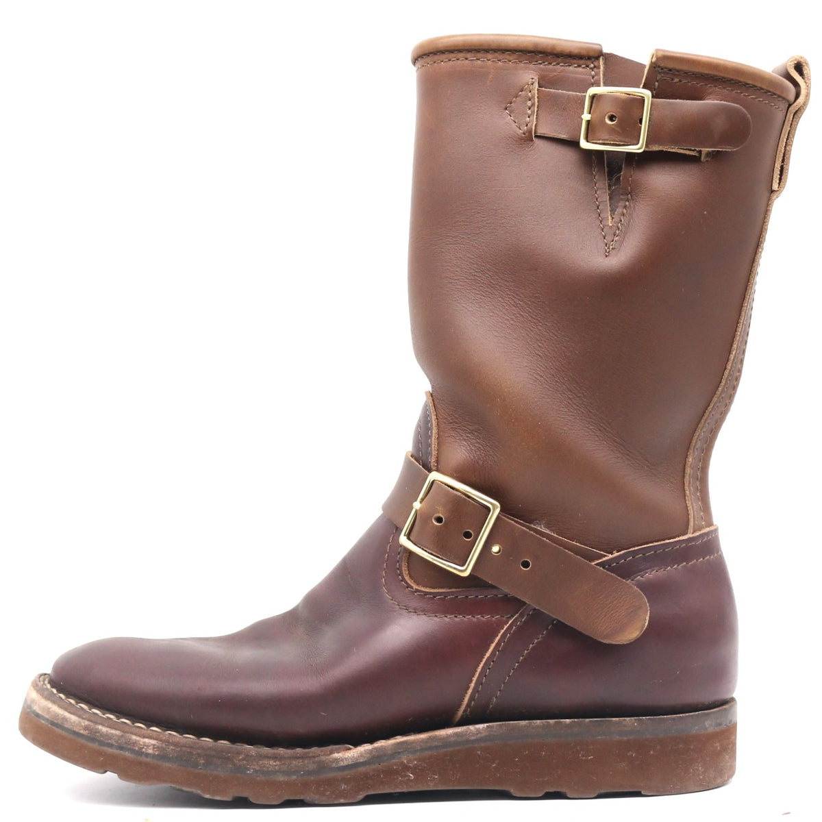 A mid-calf brown leather boot with two adjustable buckle straps, one on the shaft and one on the ankle, shown from a side profile against a white background.