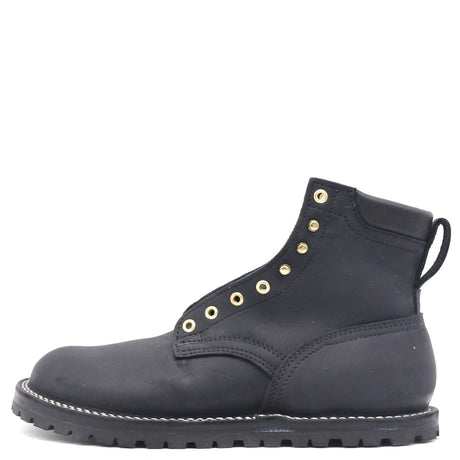 A black leather ankle boot with gold-tone metal eyelets and a pull tab, shown from a side profile view on a white background.