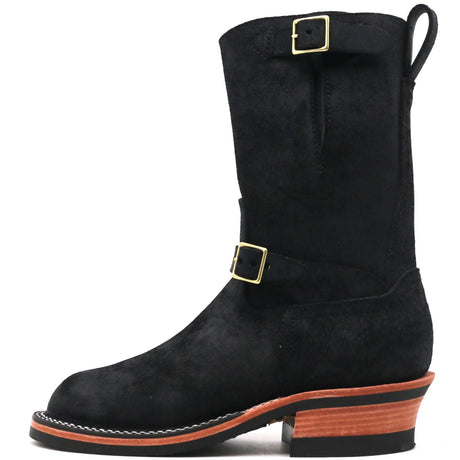A black suede mid-calf western boot with gold buckle details, a pull tab, and a stacked brown and black block heel, shown from a side profile on a white background.