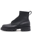 A black leather ankle boot with a rugged lug sole, side eyelets, and a pull tab, shown from a side profile on a white background.