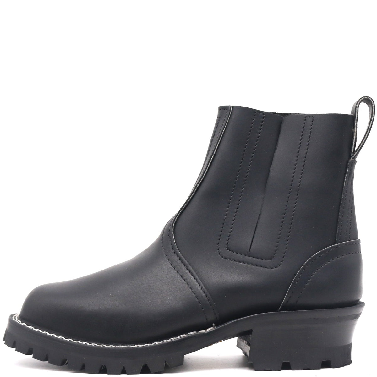 A black leather Chelsea-style ankle boot with a chunky lug sole and low block heel, shown from a side profile on a white background.