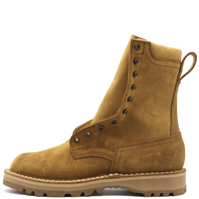 A single mid-calf suede boot in a warm camel brown color, featuring metal eyelets with decorative studs, a pull tab, and a thick lug sole, shown against a plain white background.
