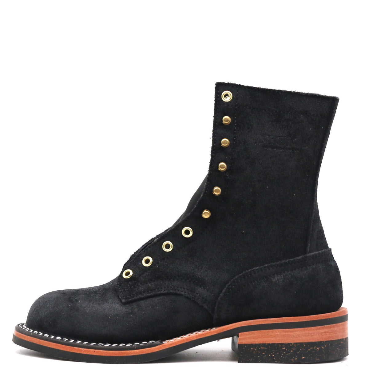 A black suede lace-up ankle boot with gold-tone metal eyelets and studs, a low block heel, and a contrasting orange-brown welt and outsole, shown against a plain white background.